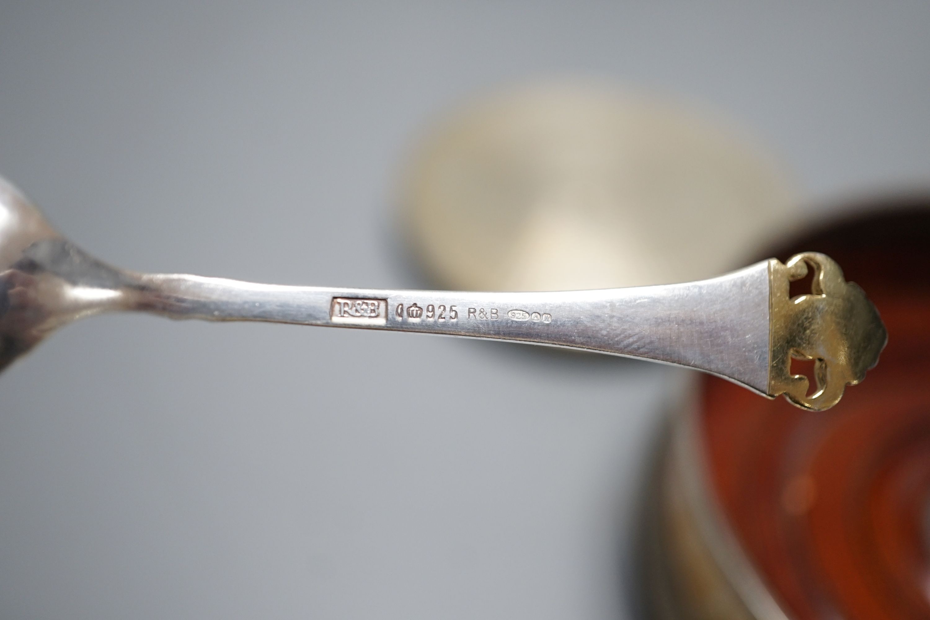 A cased set of six German 800 standard teaspoons by Robbe & Berking, a set of six silver mounted glass coaster and a modern silver mounted wine coaster.